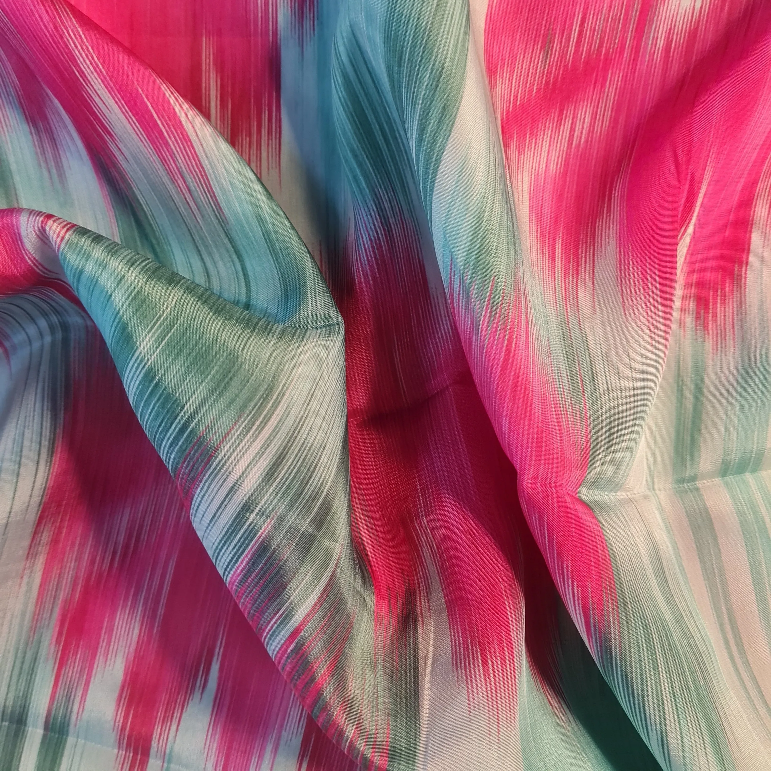 Exclusive Light Green Multicolor Ikkat print Crepe Fabric